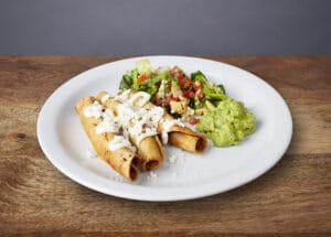 Image of flautas with side salad and guacamole